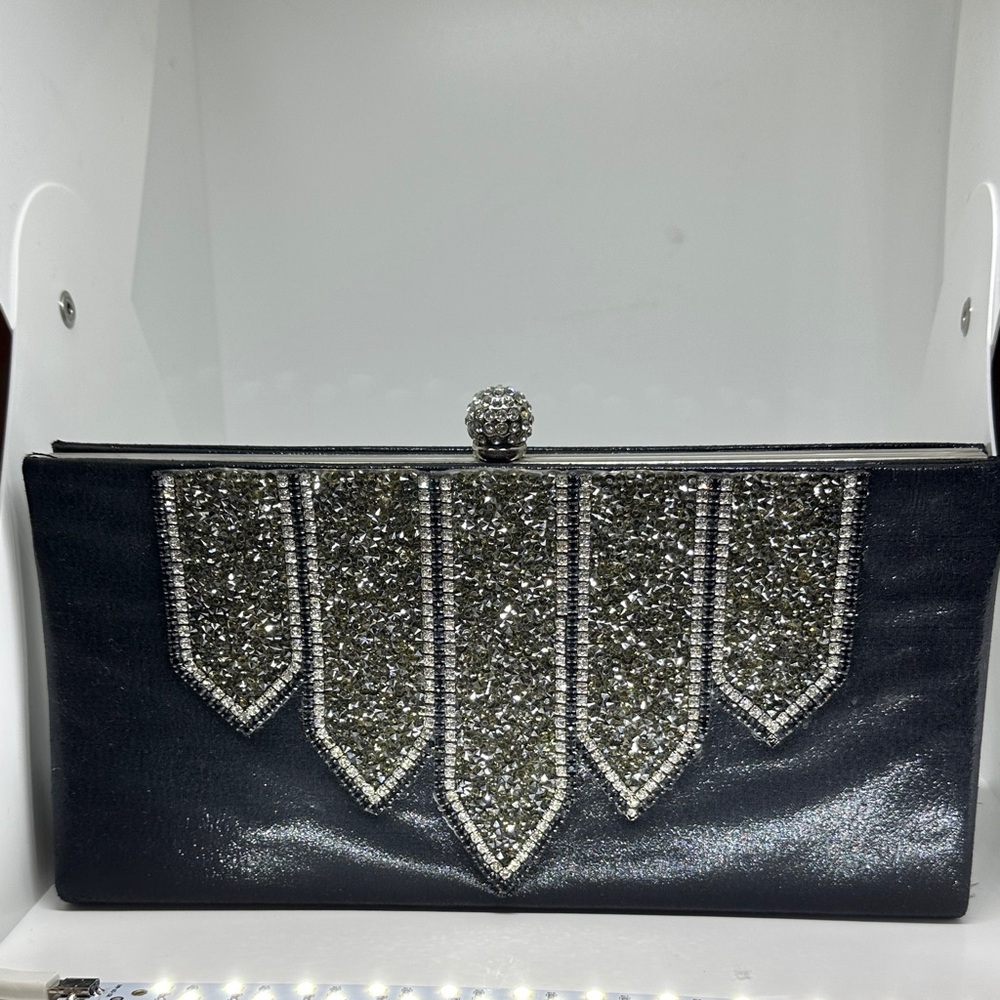 Elegant BeBe Black and Silver Clutch. Some crystals are missing